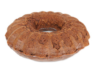 A homemade chocolate cake (brownie) isolated on a white background